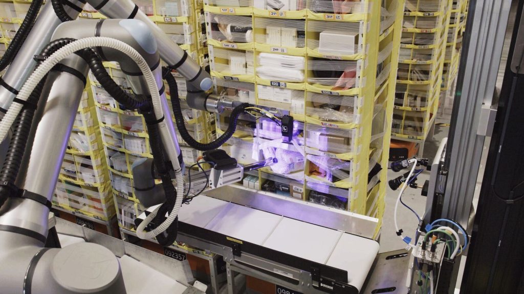 Vulcan uses an arm that carries a camera and a suction cup to pick items from our storage pods.